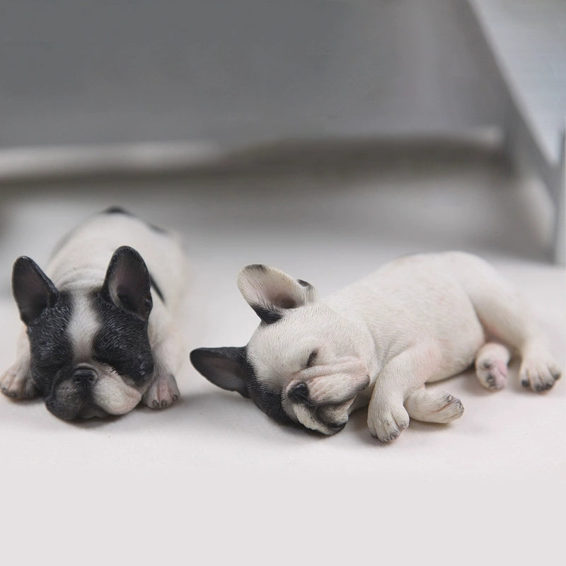 This image features a pair of intricately detailed 1/6 scale French Bulldog models in a sleeping position. The lifelike design captures the essence of these adorable dogs, making them perfect for collectors and dog enthusiasts. Each model showcases a different color variation, adding variety to your collection.