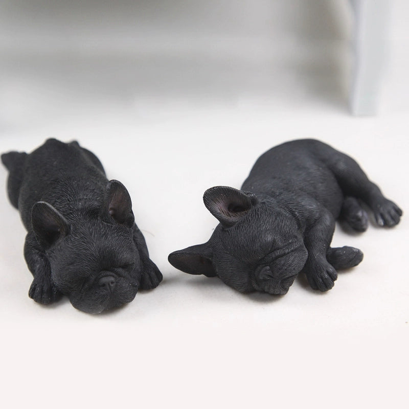 This image features a pair of intricately detailed 1/6 scale French Bulldog models in a sleeping position. The lifelike design captures the essence of these adorable dogs, making them perfect for collectors and dog enthusiasts. Each model showcases a different color variation, adding variety to your collection.