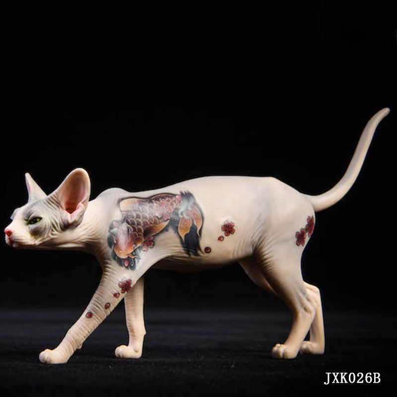 A set of 1/6 scale Sphinx Hairless Cat resin models featuring detailed tattoo designs and realistic facial expressions. The collection showcases the unique, sleek look of hairless cats, with a focus on their skin texture and distinct body contours. The figures are posed in both sitting and stretching positions, emphasizing their graceful and elegant nature.