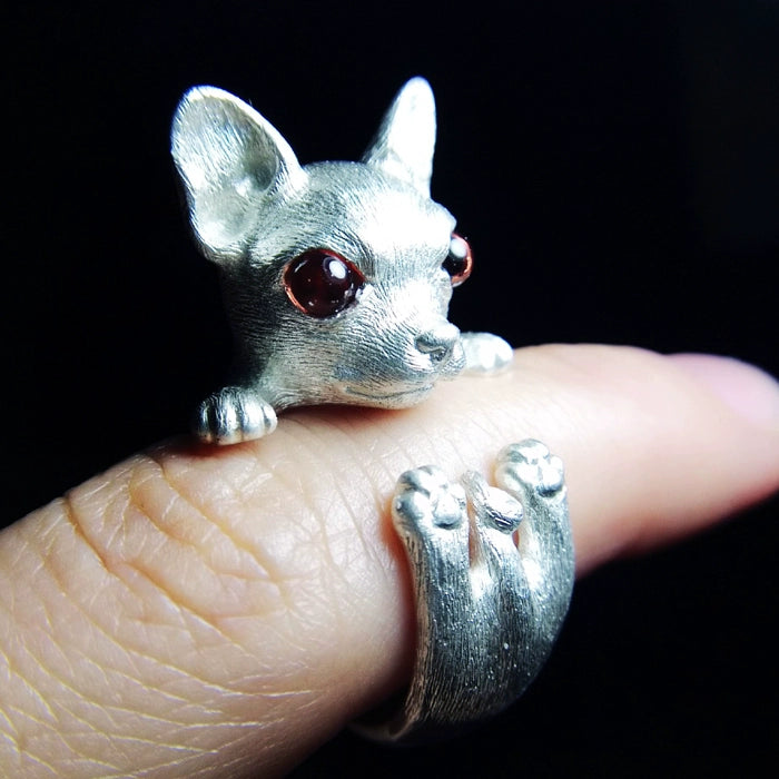 Artisan 925 sterling silver Chihuahua Puppy Ring featuring hand-set gemstone eyes, including red garnet, blue sapphire, green diopside, and coffee-colored topaz. The ring is available in classic silver and antique black finishes, perfect as a unique, customizable dog lover's jewelry piece.