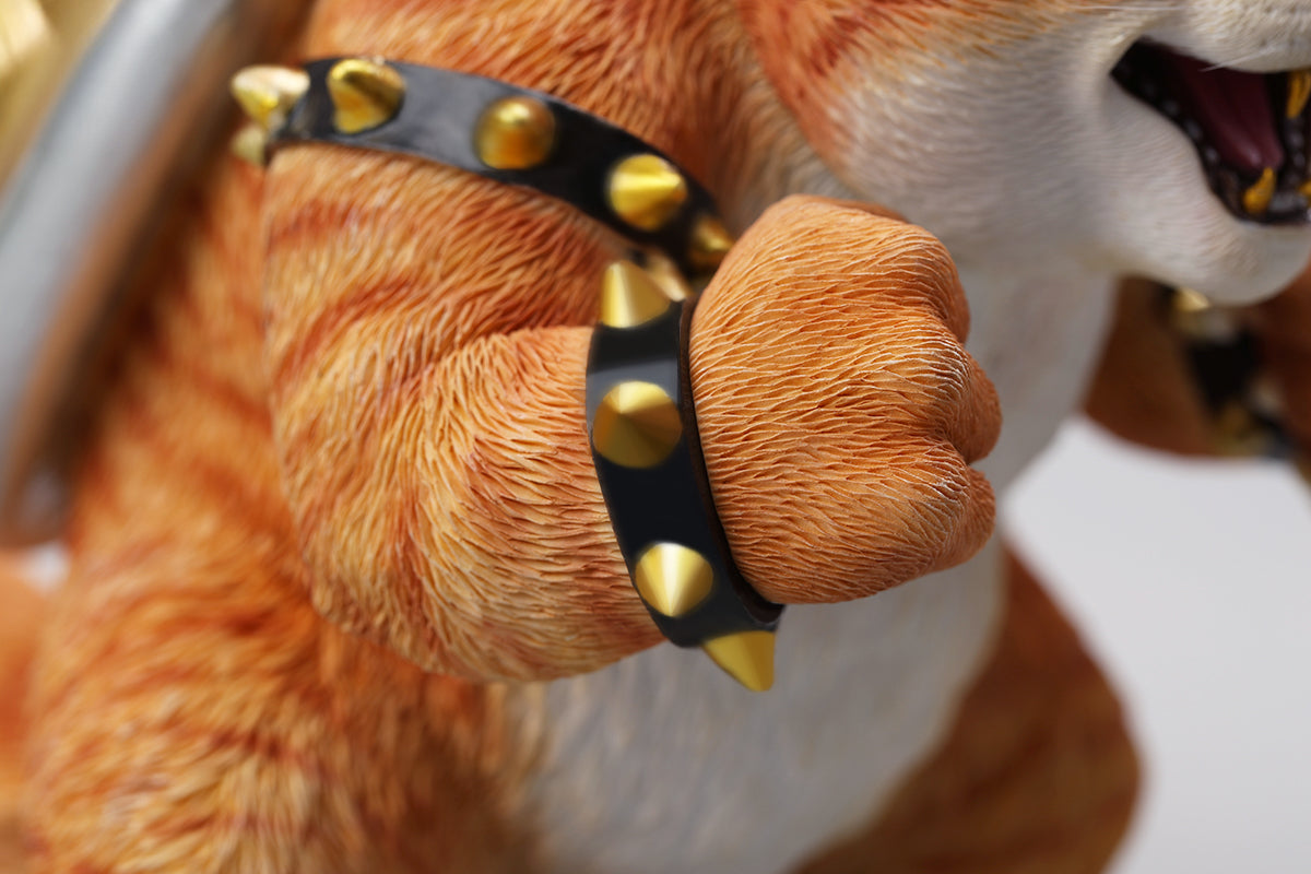 A Bowser Cat figurine with a removable magnetic head and a pipe accessory. The cat has a spiked shell on its back, designed for collectors and fans of unique action figures. The figurine combines feline charm with Bowser's iconic style, making it an ideal collectible piece.