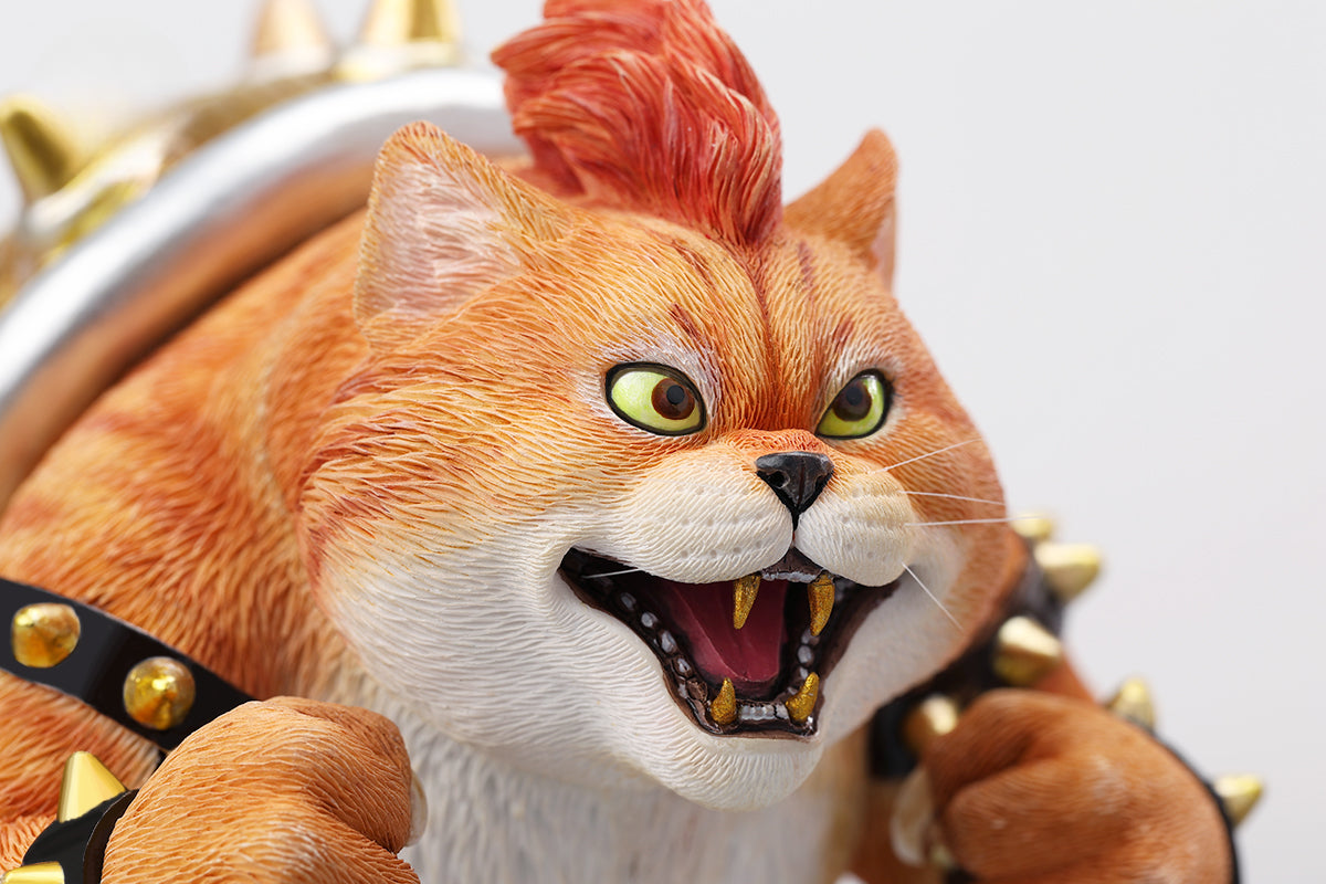 A Bowser Cat figurine with a removable magnetic head and a pipe accessory. The cat has a spiked shell on its back, designed for collectors and fans of unique action figures. The figurine combines feline charm with Bowser's iconic style, making it an ideal collectible piece.