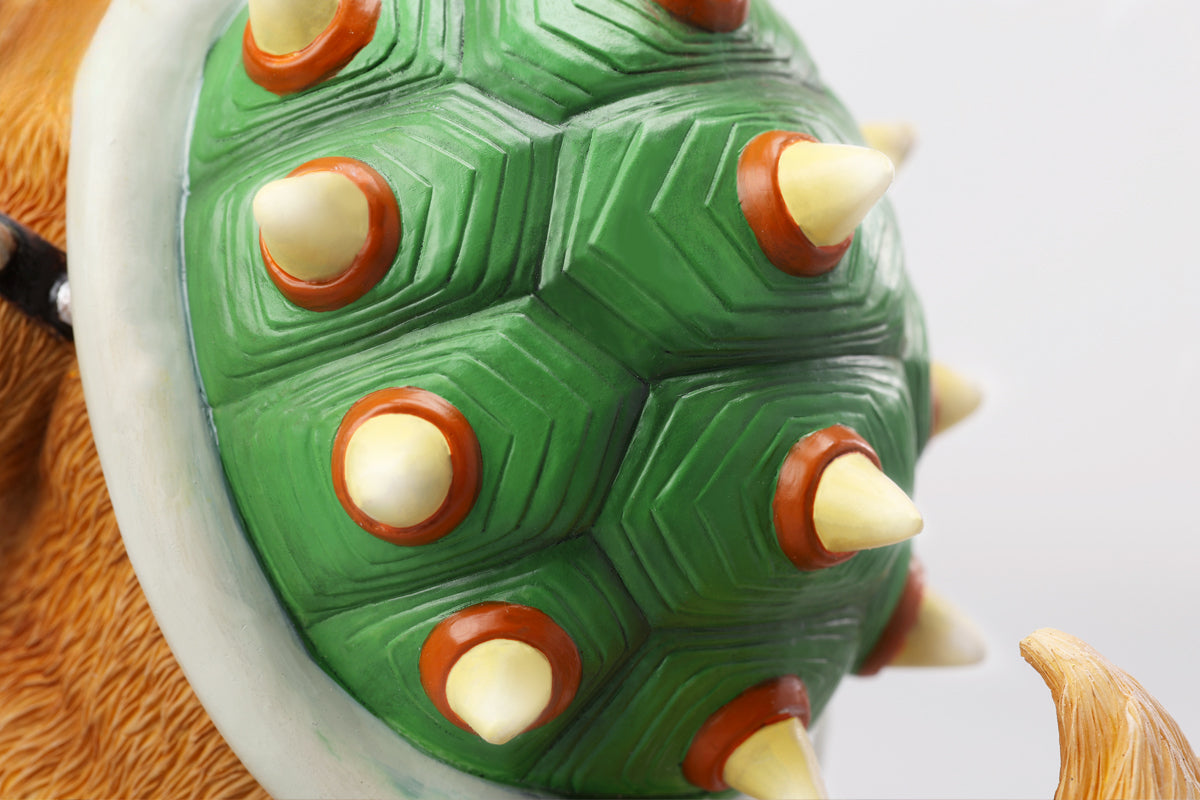 A Bowser Cat figurine with a removable magnetic head and a pipe accessory. The cat has a spiked shell on its back, designed for collectors and fans of unique action figures. The figurine combines feline charm with Bowser's iconic style, making it an ideal collectible piece.