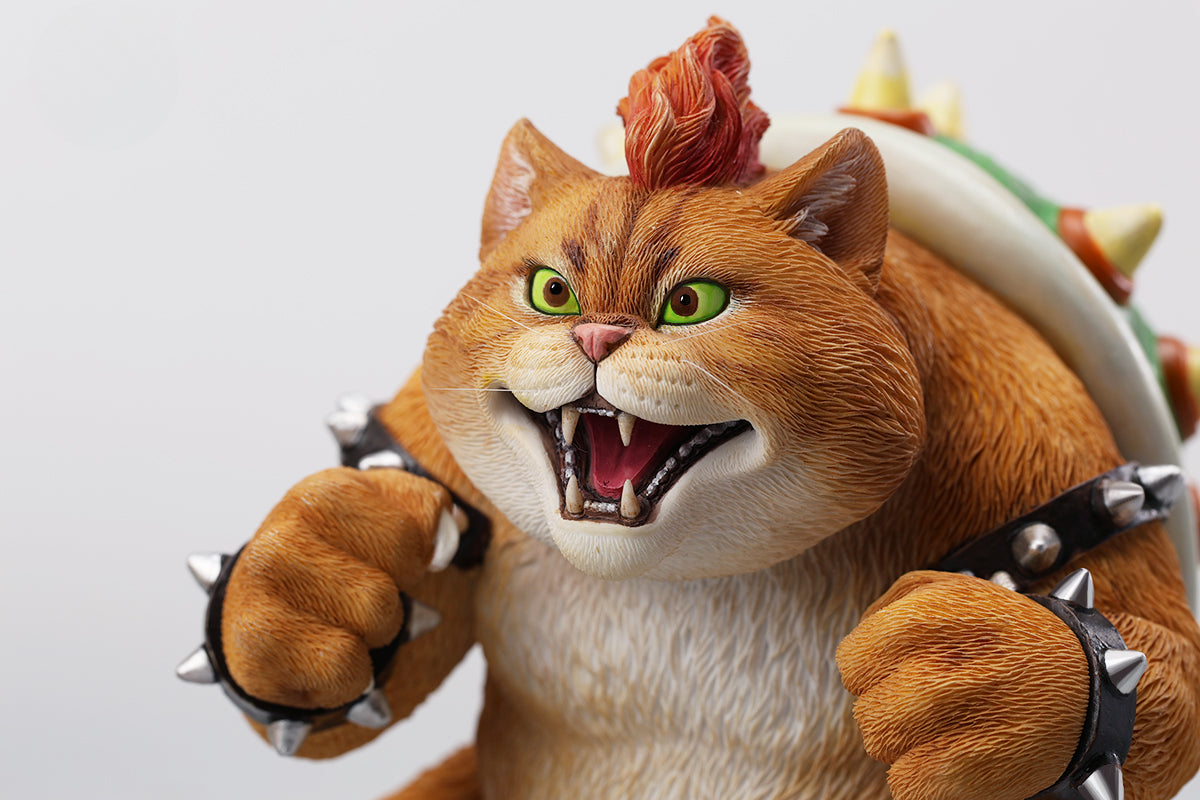 A Bowser Cat figurine with a removable magnetic head and a pipe accessory. The cat has a spiked shell on its back, designed for collectors and fans of unique action figures. The figurine combines feline charm with Bowser's iconic style, making it an ideal collectible piece.
