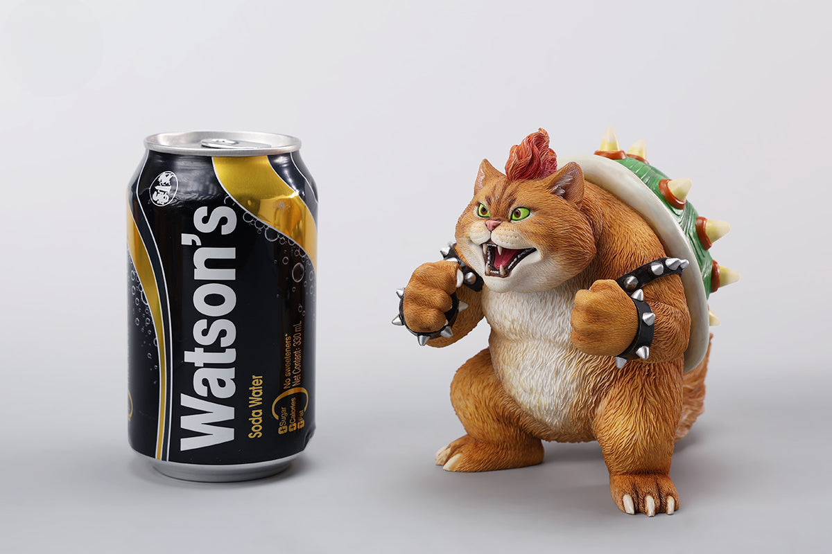 A Bowser Cat figurine with a removable magnetic head and a pipe accessory. The cat has a spiked shell on its back, designed for collectors and fans of unique action figures. The figurine combines feline charm with Bowser's iconic style, making it an ideal collectible piece.