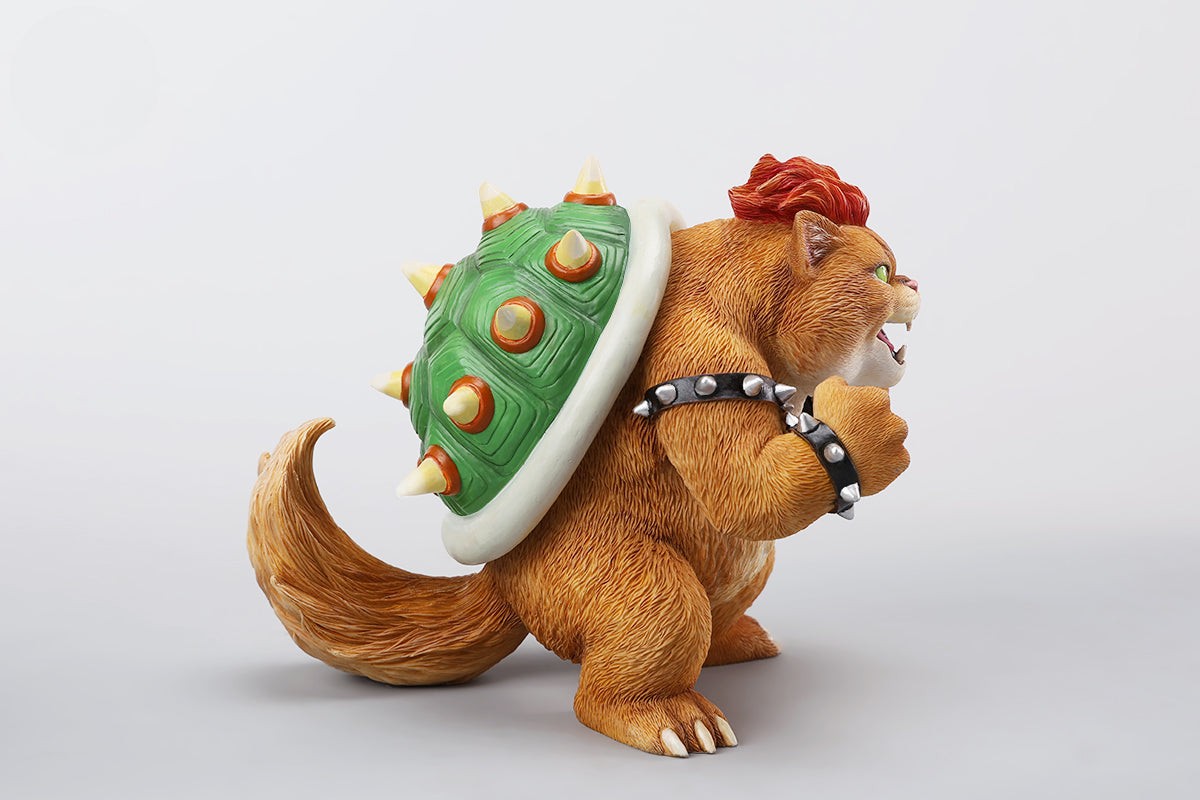 A Bowser Cat figurine with a removable magnetic head and a pipe accessory. The cat has a spiked shell on its back, designed for collectors and fans of unique action figures. The figurine combines feline charm with Bowser's iconic style, making it an ideal collectible piece.