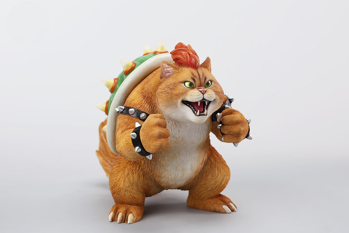 A Bowser Cat figurine with a removable magnetic head and a pipe accessory. The cat has a spiked shell on its back, designed for collectors and fans of unique action figures. The figurine combines feline charm with Bowser's iconic style, making it an ideal collectible piece.