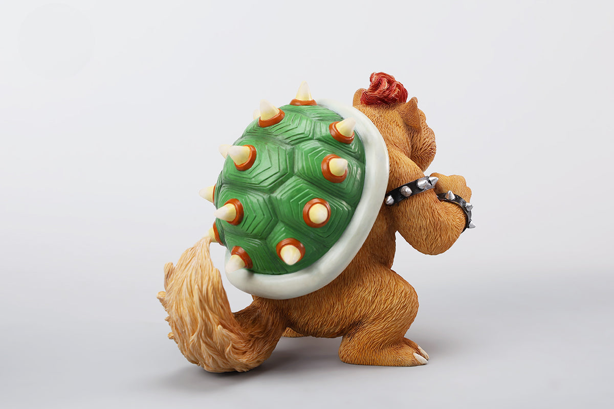 A Bowser Cat figurine with a removable magnetic head and a pipe accessory. The cat has a spiked shell on its back, designed for collectors and fans of unique action figures. The figurine combines feline charm with Bowser's iconic style, making it an ideal collectible piece.