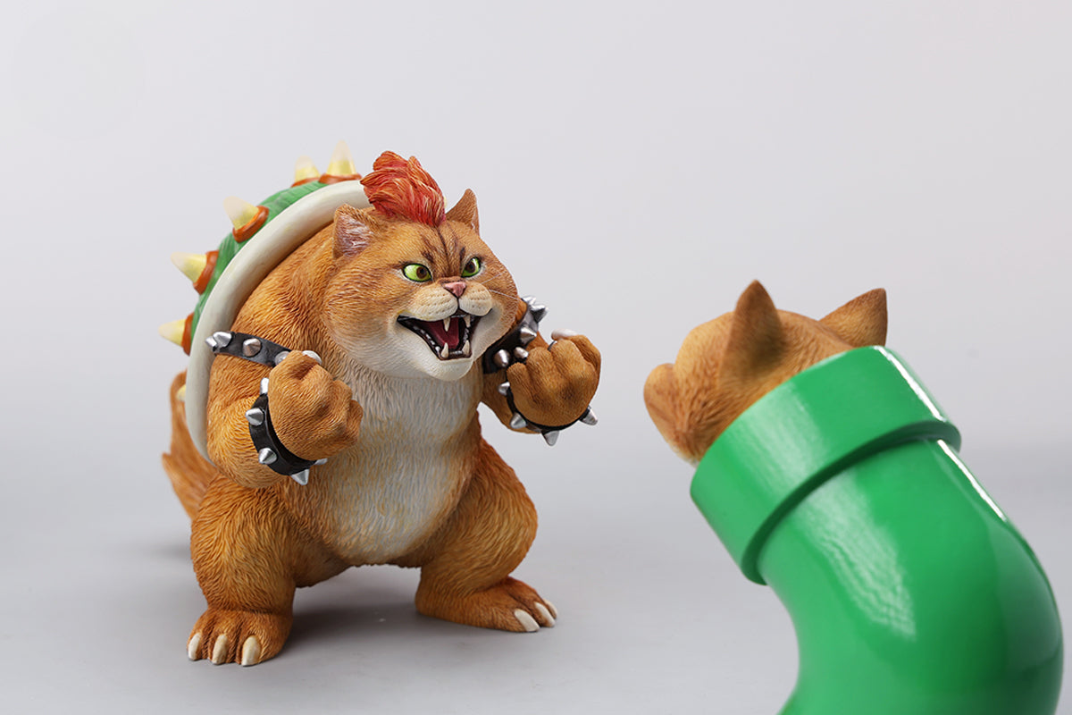 A Bowser Cat figurine with a removable magnetic head and a pipe accessory. The cat has a spiked shell on its back, designed for collectors and fans of unique action figures. The figurine combines feline charm with Bowser's iconic style, making it an ideal collectible piece.