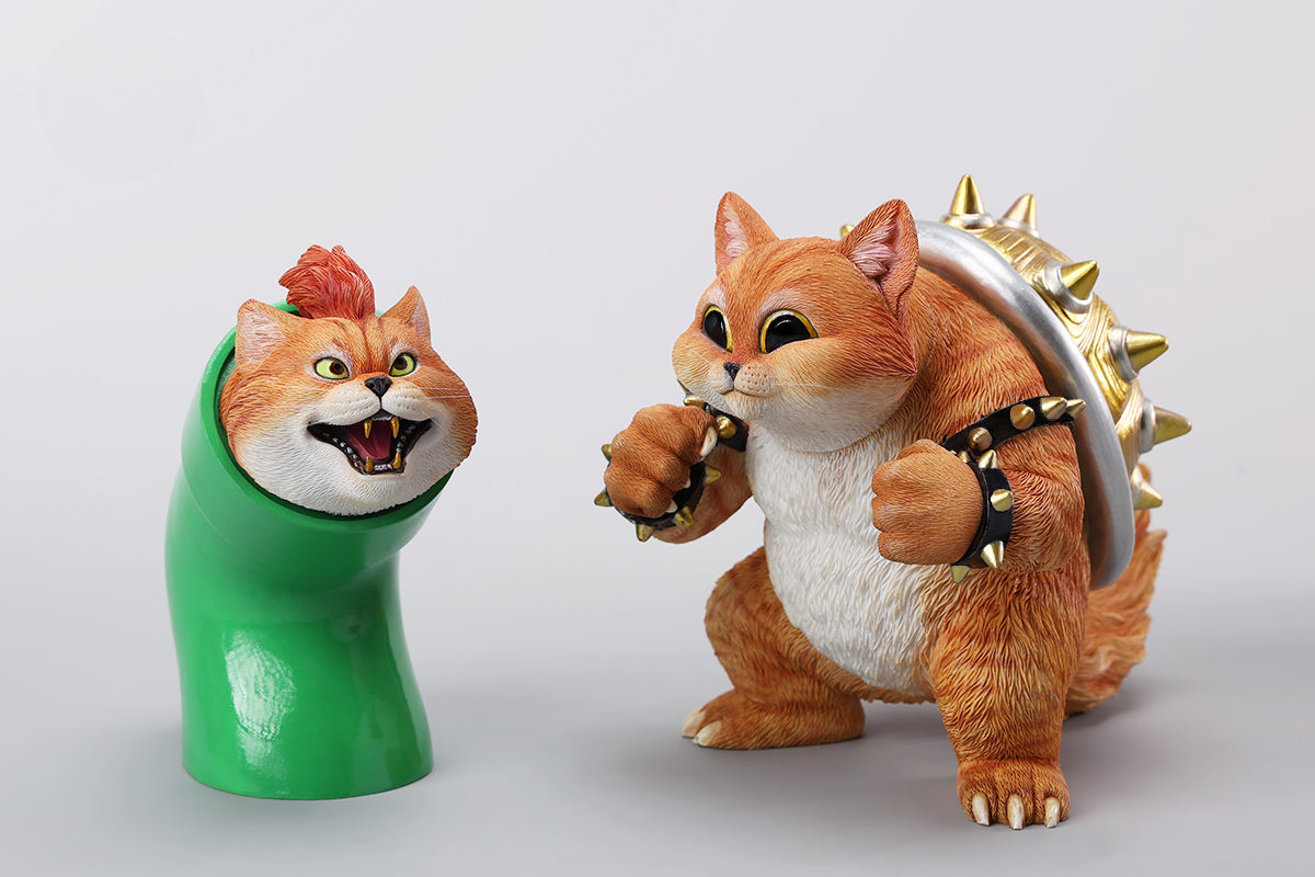 A Bowser Cat figurine with a removable magnetic head and a pipe accessory. The cat has a spiked shell on its back, designed for collectors and fans of unique action figures. The figurine combines feline charm with Bowser's iconic style, making it an ideal collectible piece.
