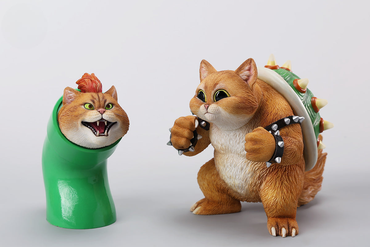 A Bowser Cat figurine with a removable magnetic head and a pipe accessory. The cat has a spiked shell on its back, designed for collectors and fans of unique action figures. The figurine combines feline charm with Bowser's iconic style, making it an ideal collectible piece.