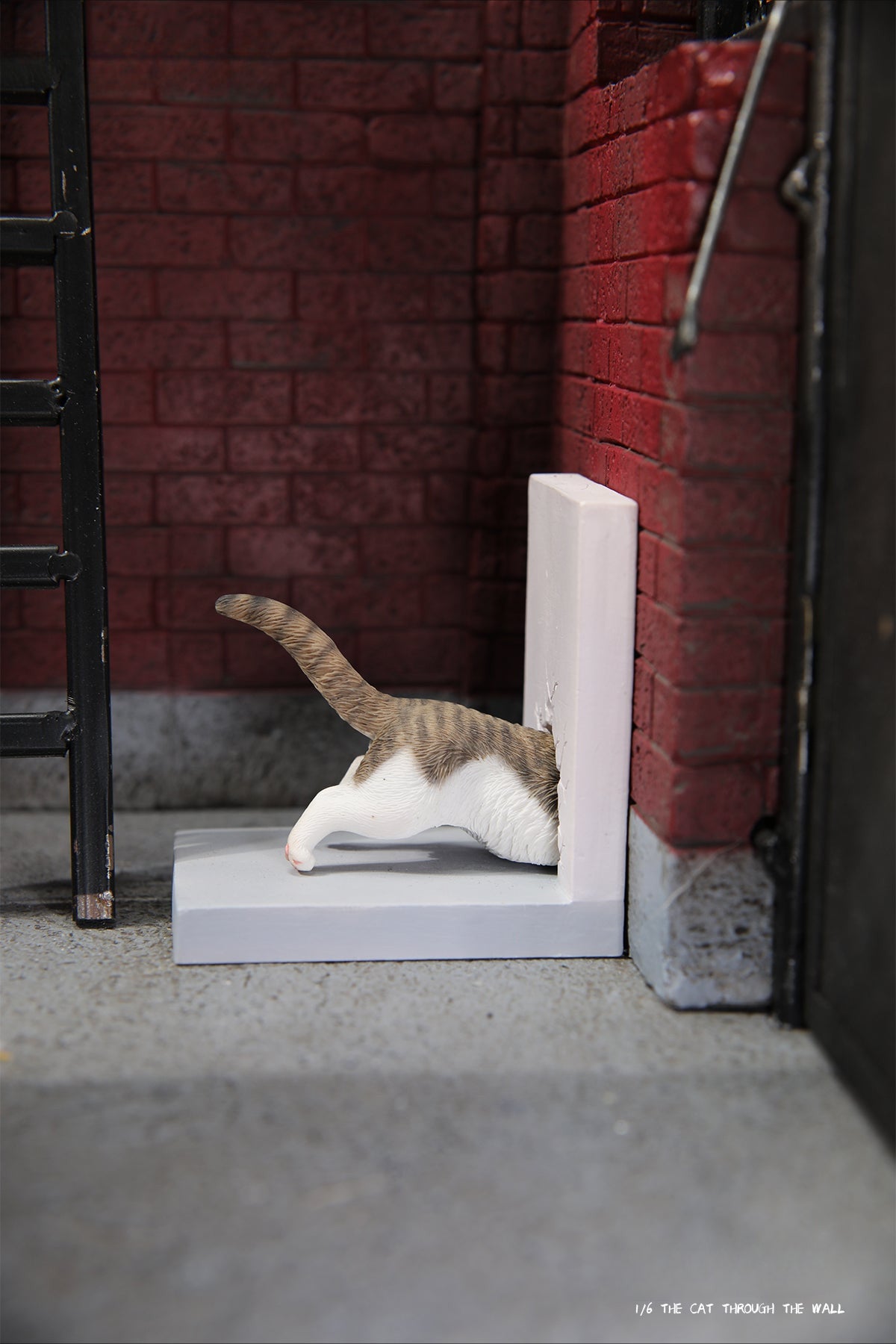 A series of 1/6 scale cat figurines designed to appear as though they are crawling through walls. Each model features different colored cats—black, white, orange, and calico—emerging through a wall, capturing a playful and curious moment.