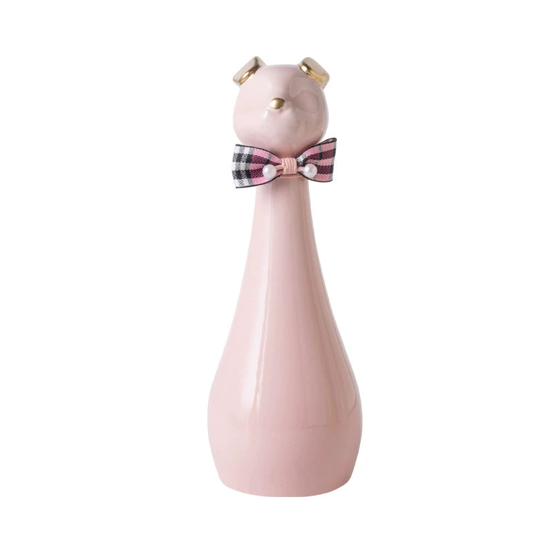 ceramic cat-shaped pet cremation urn with a glossy finish, featuring a stylish cat figure with a bow tie on a slender base, ideal for North American pet owners. This handcrafted urn provides secure ashes storage, perfect for home memorial display on mantels or shelves, with a vibrant yellow hue and elegant design