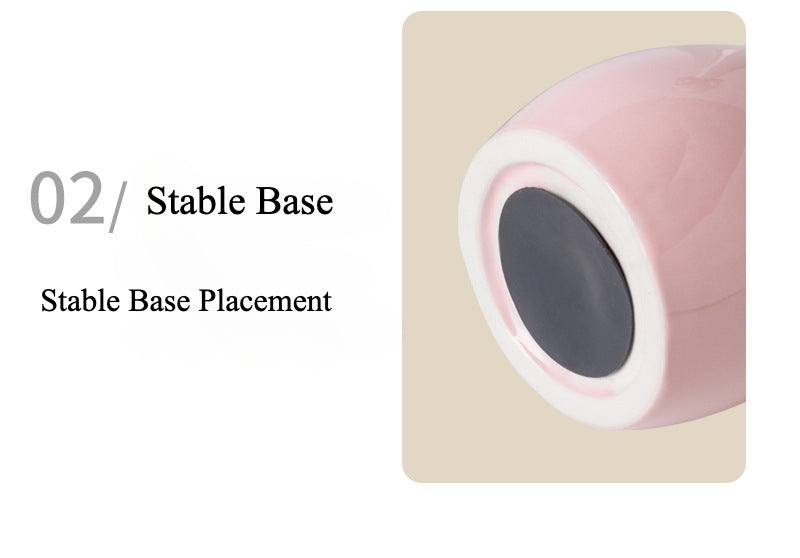 Yellow ceramic cat-shaped pet cremation urn with a glossy finish, featuring a stylish cat figure with a bow tie on a slender base, ideal for North American pet owners. This handcrafted urn provides secure ashes storage, perfect for home memorial display on mantels or shelves, with a vibrant yellow hue and elegant design.