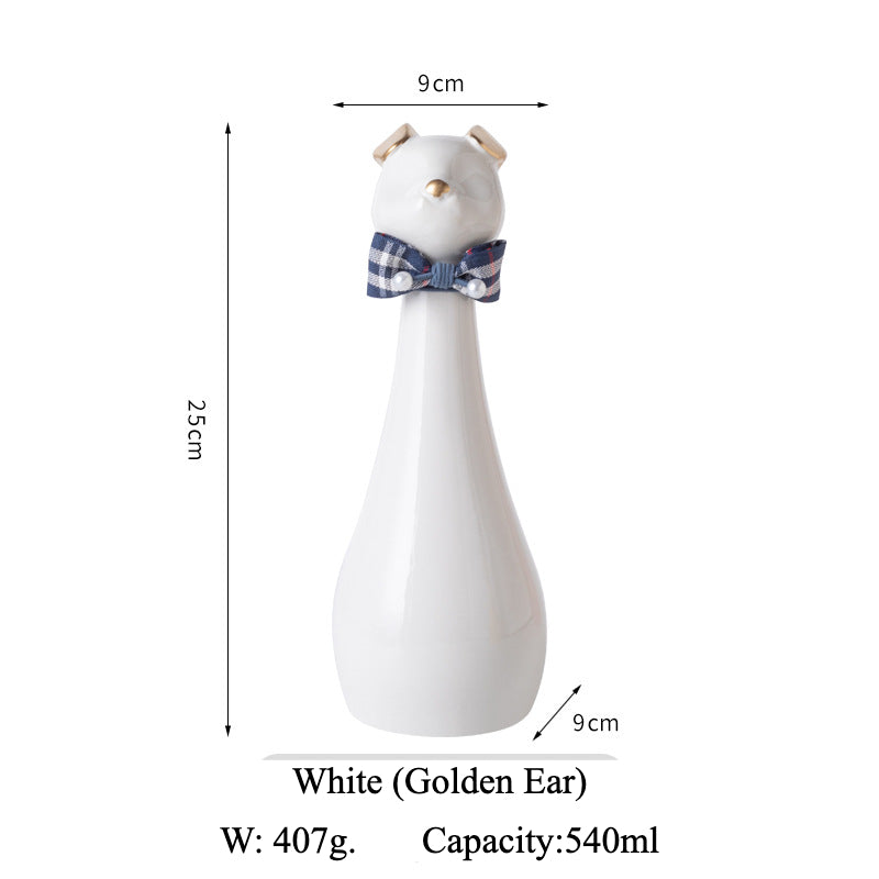 Yellow ceramic cat-shaped pet cremation urn with a glossy finish, featuring a stylish cat figure with a bow tie on a slender base, ideal for North American pet owners. This handcrafted urn provides secure ashes storage, perfect for home memorial display on mantels or shelves, with a vibrant yellow hue and elegant design.