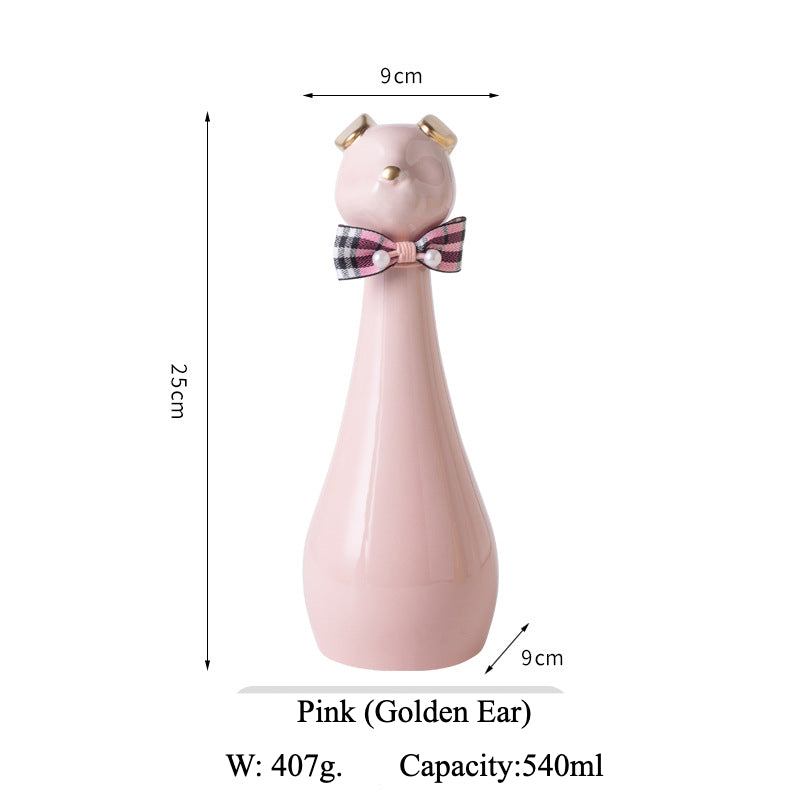 Yellow ceramic cat-shaped pet cremation urn with a glossy finish, featuring a stylish cat figure with a bow tie on a slender base, ideal for North American pet owners. This handcrafted urn provides secure ashes storage, perfect for home memorial display on mantels or shelves, with a vibrant yellow hue and elegant design.