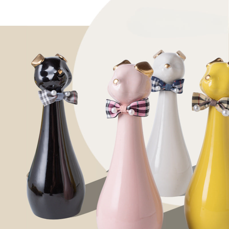 Yellow ceramic cat-shaped pet cremation urn with a glossy finish, featuring a stylish cat figure with a bow tie on a slender base, ideal for North American pet owners. This handcrafted urn provides secure ashes storage, perfect for home memorial display on mantels or shelves, with a vibrant yellow hue and elegant design.