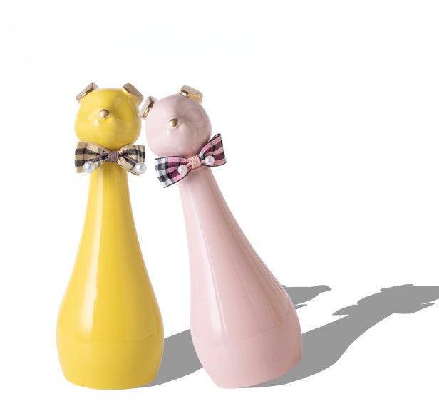 Yellow ceramic cat-shaped pet cremation urn with a glossy finish, featuring a stylish cat figure with a bow tie on a slender base, ideal for North American pet owners. This handcrafted urn provides secure ashes storage, perfect for home memorial display on mantels or shelves, with a vibrant yellow hue and elegant design.