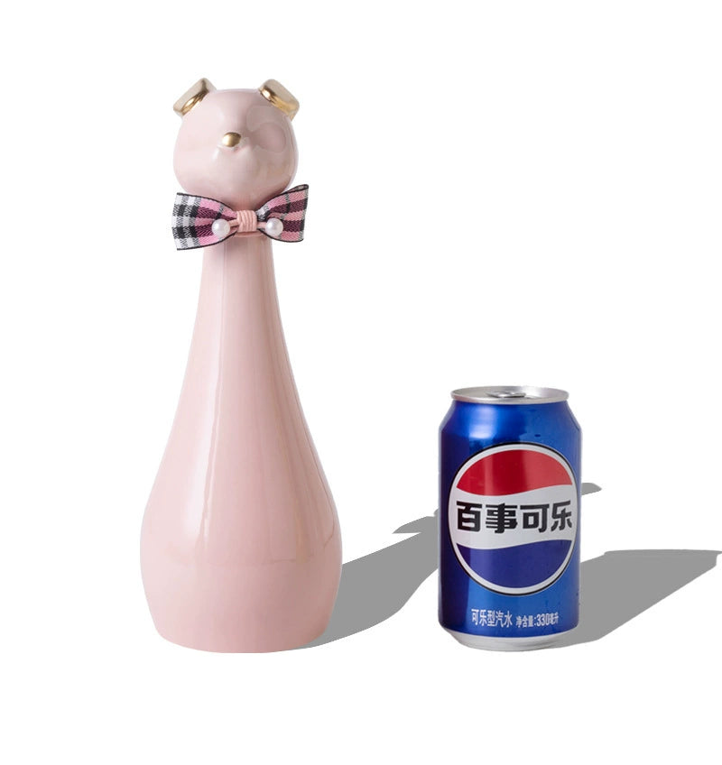 Yellow ceramic cat-shaped pet cremation urn with a glossy finish, featuring a stylish cat figure with a bow tie on a slender base, ideal for North American pet owners. This handcrafted urn provides secure ashes storage, perfect for home memorial display on mantels or shelves, with a vibrant yellow hue and elegant design.