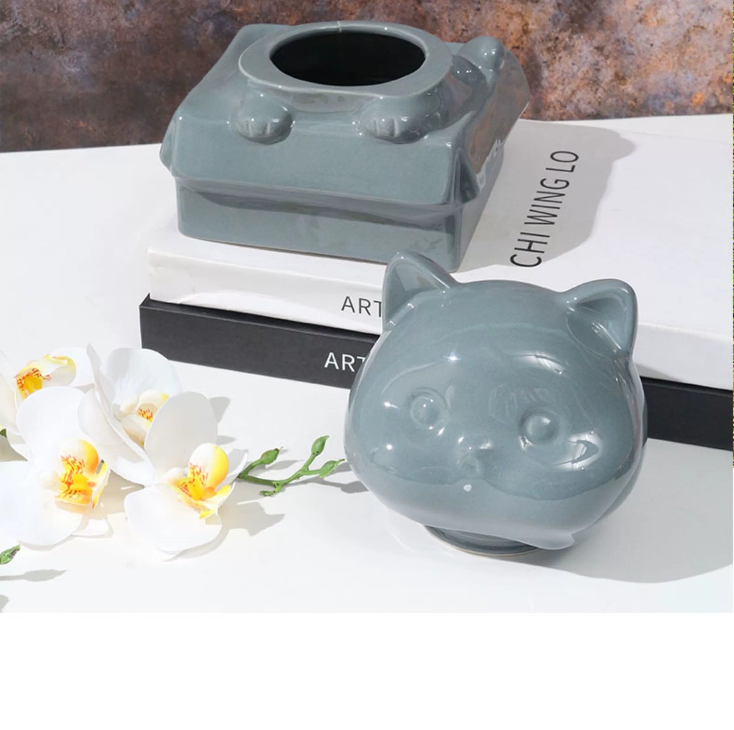 Orange ceramic dog-shaped pet urn with a glossy finish, featuring a cute dog figure on a square base, ideal for North American pet owners. This handcrafted memorial urn securely stores pet ashes, perfect for home display on mantels or shelves, offering a dignified tribute with its vibrant color and unique design.