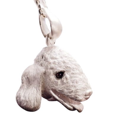 Close-up image of the Chameleon Bellington Pendant, showcasing intricate handcrafted details in 925 silver with gemstone eyes. The pendant captures the essence of the Bellington dog, highlighting fine fur texture and expressive features. Available in silver or antique black finish.