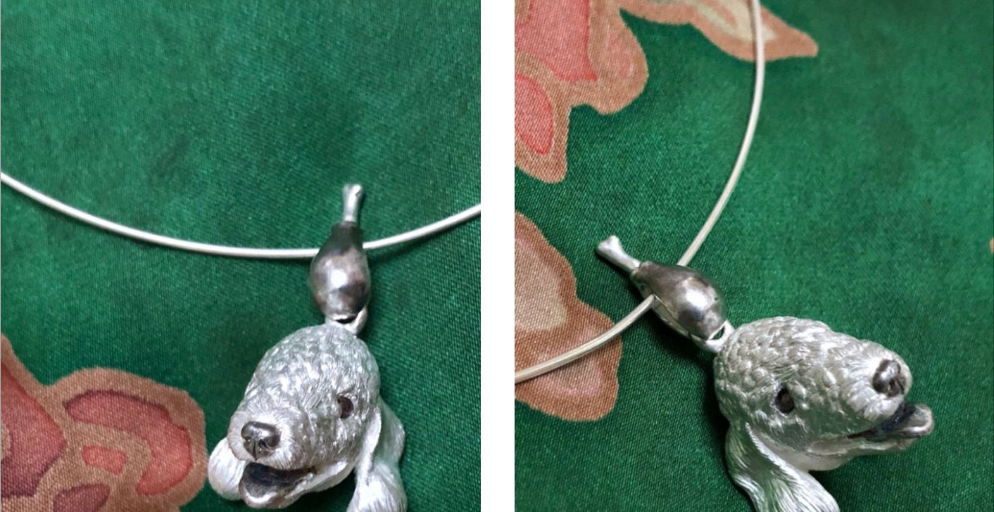 Close-up image of the Chameleon Bellington Pendant, showcasing intricate handcrafted details in 925 silver with gemstone eyes. The pendant captures the essence of the Bellington dog, highlighting fine fur texture and expressive features. Available in silver or antique black finish.