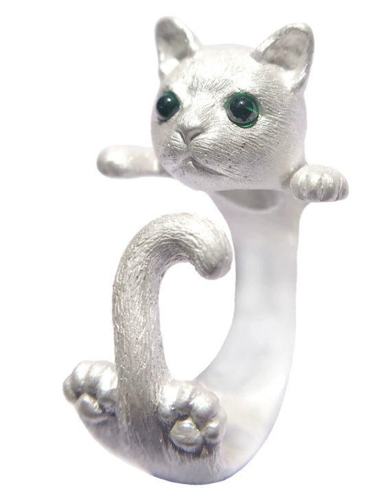 A handcrafted cat ring made of 925 sterling silver, featuring detailed fur textures and vibrant gemstone eyes, showcasing the playful pose of a kitten with its tail wrapped around the finger. Available in both silver and antique black finishes.