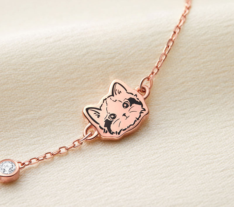 Close-up image of a Custom Pet Portrait Bracelet in S925 silver featuring a detailed charm of a pet's face. The bracelet includes a synthetic zircon stone accent, showcasing elegant craftsmanship. Perfect for pet lovers, this personalized bracelet is custom-made based on photos provided, capturing the unique likeness of a beloved pet. Handcrafted with care, it serves as a lasting tribute or memorial keepsake, emphasizing high-quality materials and attention to detail. Ideal for those seeking a unique and me