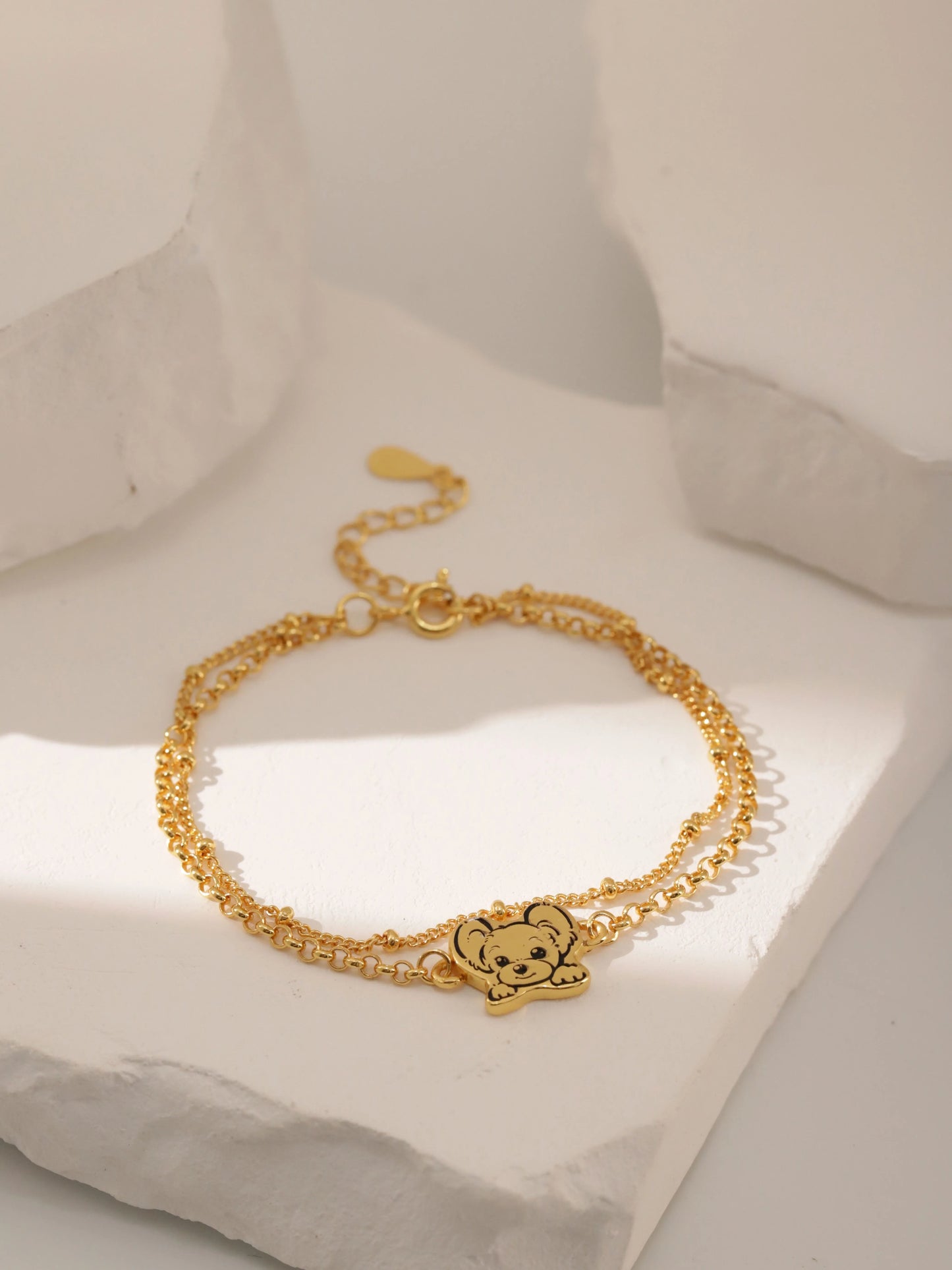 Custom Pet Portrait Bracelet featuring a double-chain design in S925 silver, with a personalized engraving of a pet's face based on a provided photo. This handmade bracelet captures the unique likeness of your pet, creating a meaningful keepsake for pet owners, available in silver, gold, or rose gold finishes. Ideal as a pet memorial gift or a personal memento.

