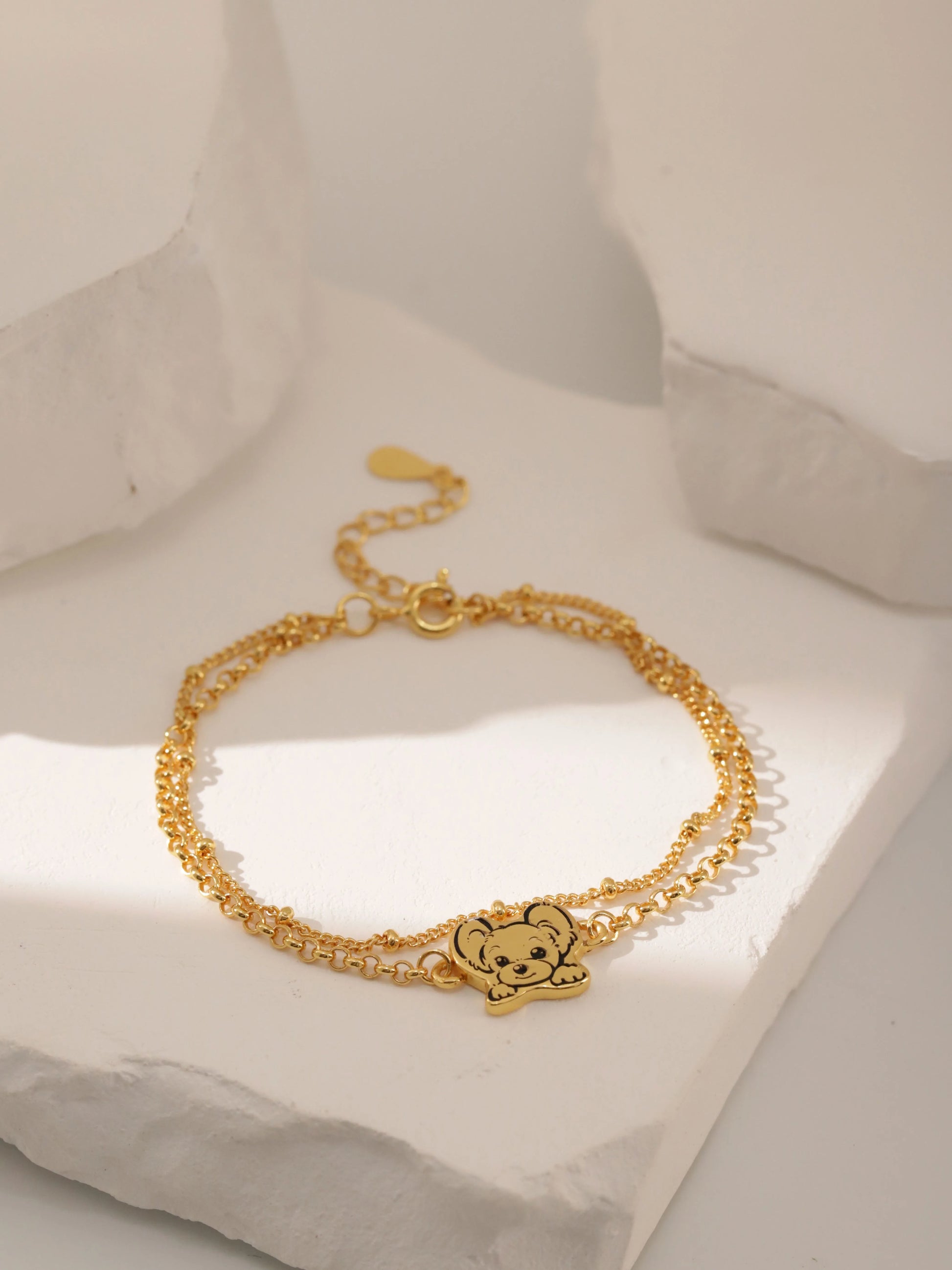 Custom Pet Portrait Bracelet featuring a double-chain design in S925 silver, with a personalized engraving of a pet's face based on a provided photo. This handmade bracelet captures the unique likeness of your pet, creating a meaningful keepsake for pet owners, available in silver, gold, or rose gold finishes. Ideal as a pet memorial gift or a personal memento.

