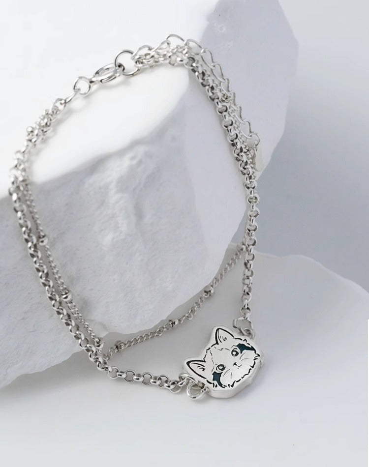 Custom Pet Portrait Bracelet featuring a double-chain design in S925 silver, with a personalized engraving of a pet's face based on a provided photo. This handmade bracelet captures the unique likeness of your pet, creating a meaningful keepsake for pet owners, available in silver, gold, or rose gold finishes. Ideal as a pet memorial gift or a personal memento.

