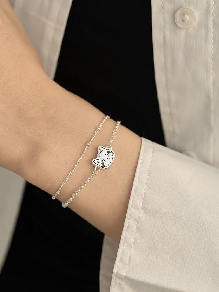 Custom Pet Portrait Bracelet featuring a double-chain design in S925 silver, with a personalized engraving of a pet's face based on a provided photo. This handmade bracelet captures the unique likeness of your pet, creating a meaningful keepsake for pet owners, available in silver, gold, or rose gold finishes. Ideal as a pet memorial gift or a personal memento.

