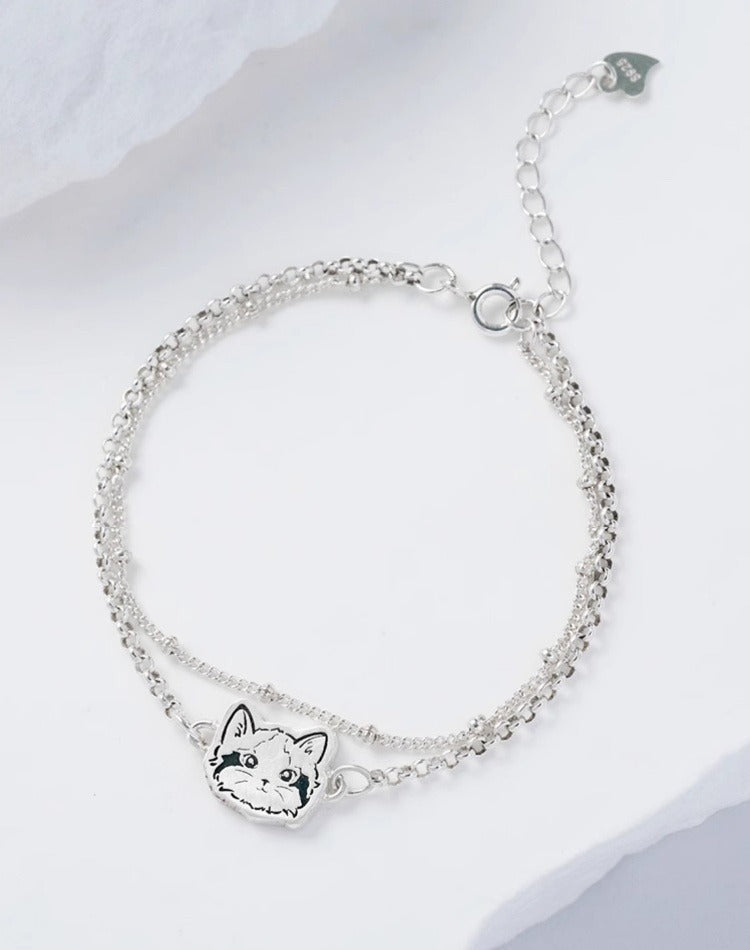 Custom Pet Portrait Bracelet featuring a double-chain design in S925 silver, with a personalized engraving of a pet's face based on a provided photo. This handmade bracelet captures the unique likeness of your pet, creating a meaningful keepsake for pet owners, available in silver, gold, or rose gold finishes. Ideal as a pet memorial gift or a personal memento.

