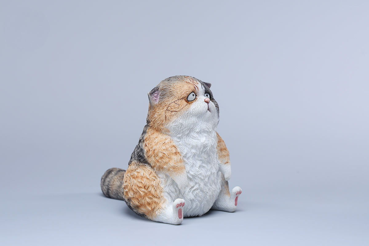 A set of three adorable Dazed Cat Model Ornaments featuring lifelike details and a cute, dazed expression. The models come in three colors: calico, gray, and orange. Each cat is depicted in a seated position, showcasing intricate fur textures and expressive eyes. Perfect for cat lovers and collectors.