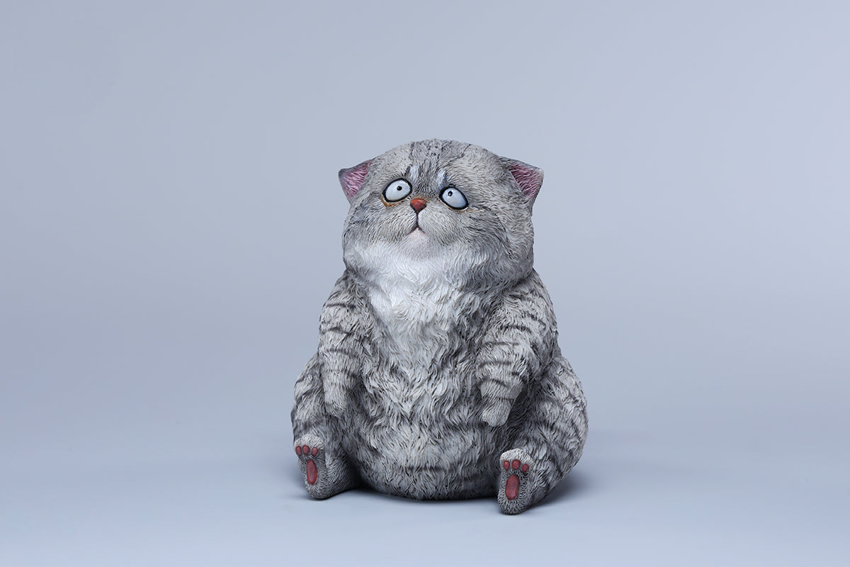 A set of three adorable Dazed Cat Model Ornaments featuring lifelike details and a cute, dazed expression. The models come in three colors: calico, gray, and orange. Each cat is depicted in a seated position, showcasing intricate fur textures and expressive eyes. Perfect for cat lovers and collectors.