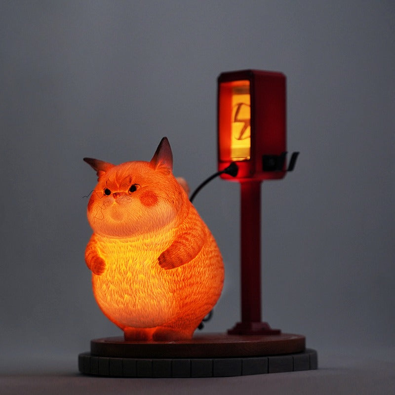 This ElectroCat Charging Station Figurine features a cute cat with a charging pump made from high-quality vinyl. The charging platform adds functionality, allowing the figurine to light up, making it a unique home decor piece and interactive collectible for cat lovers and collectors.