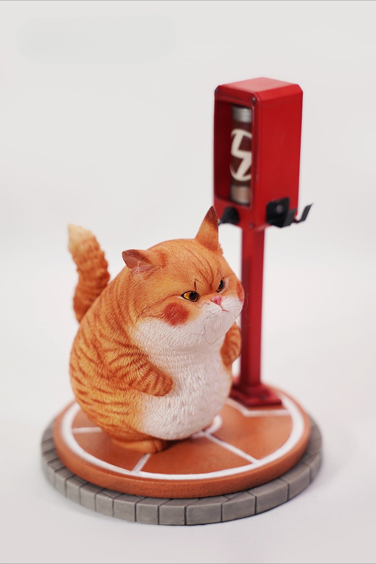 This ElectroCat Charging Station Figurine features a cute cat with a charging pump made from high-quality vinyl. The charging platform adds functionality, allowing the figurine to light up, making it a unique home decor piece and interactive collectible for cat lovers and collectors.