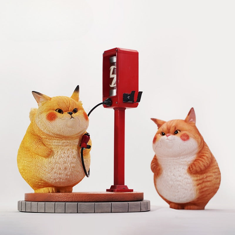 This ElectroCat Charging Station Figurine features a cute cat with a charging pump made from high-quality vinyl. The charging platform adds functionality, allowing the figurine to light up, making it a unique home decor piece and interactive collectible for cat lovers and collectors.