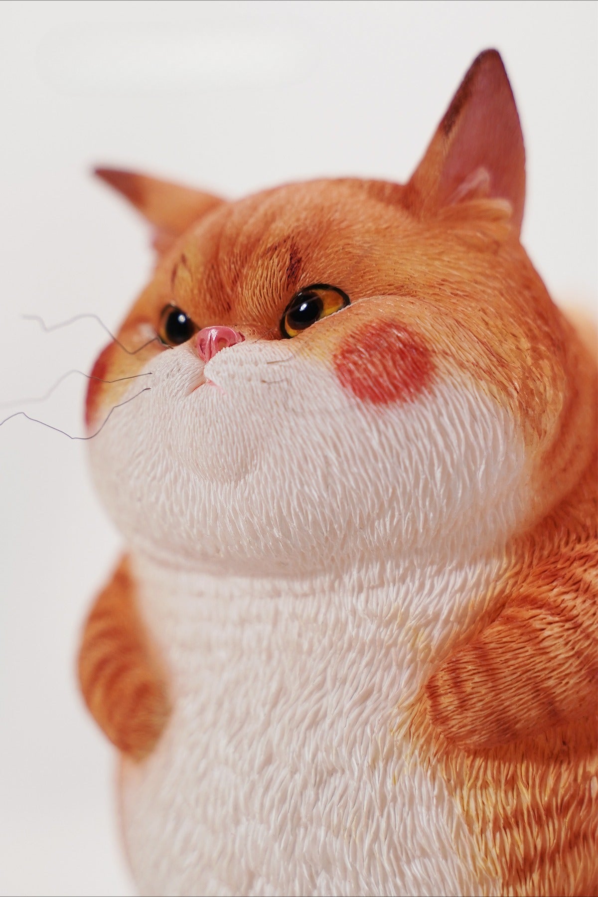 This ElectroCat Charging Station Figurine features a cute cat with a charging pump made from high-quality vinyl. The charging platform adds functionality, allowing the figurine to light up, making it a unique home decor piece and interactive collectible for cat lovers and collectors.