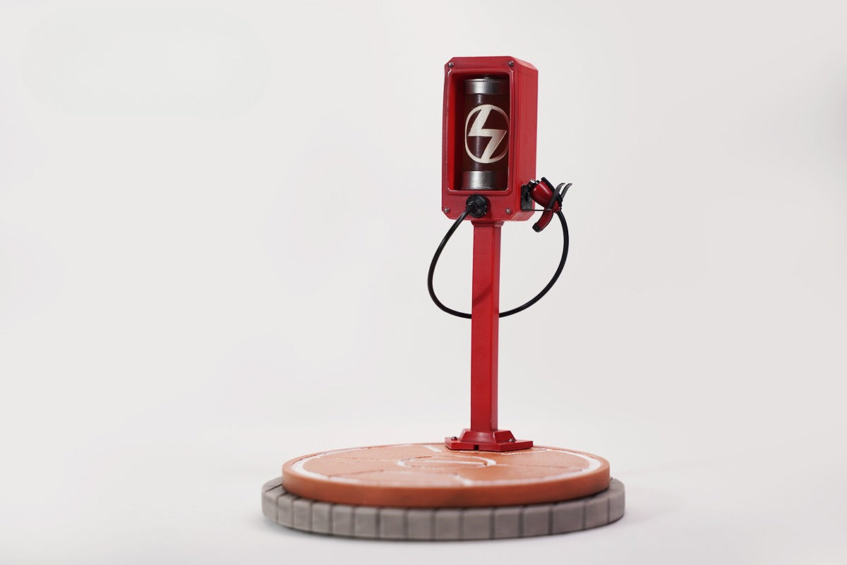 This ElectroCat Charging Station Figurine features a cute cat with a charging pump made from high-quality vinyl. The charging platform adds functionality, allowing the figurine to light up, making it a unique home decor piece and interactive collectible for cat lovers and collectors.