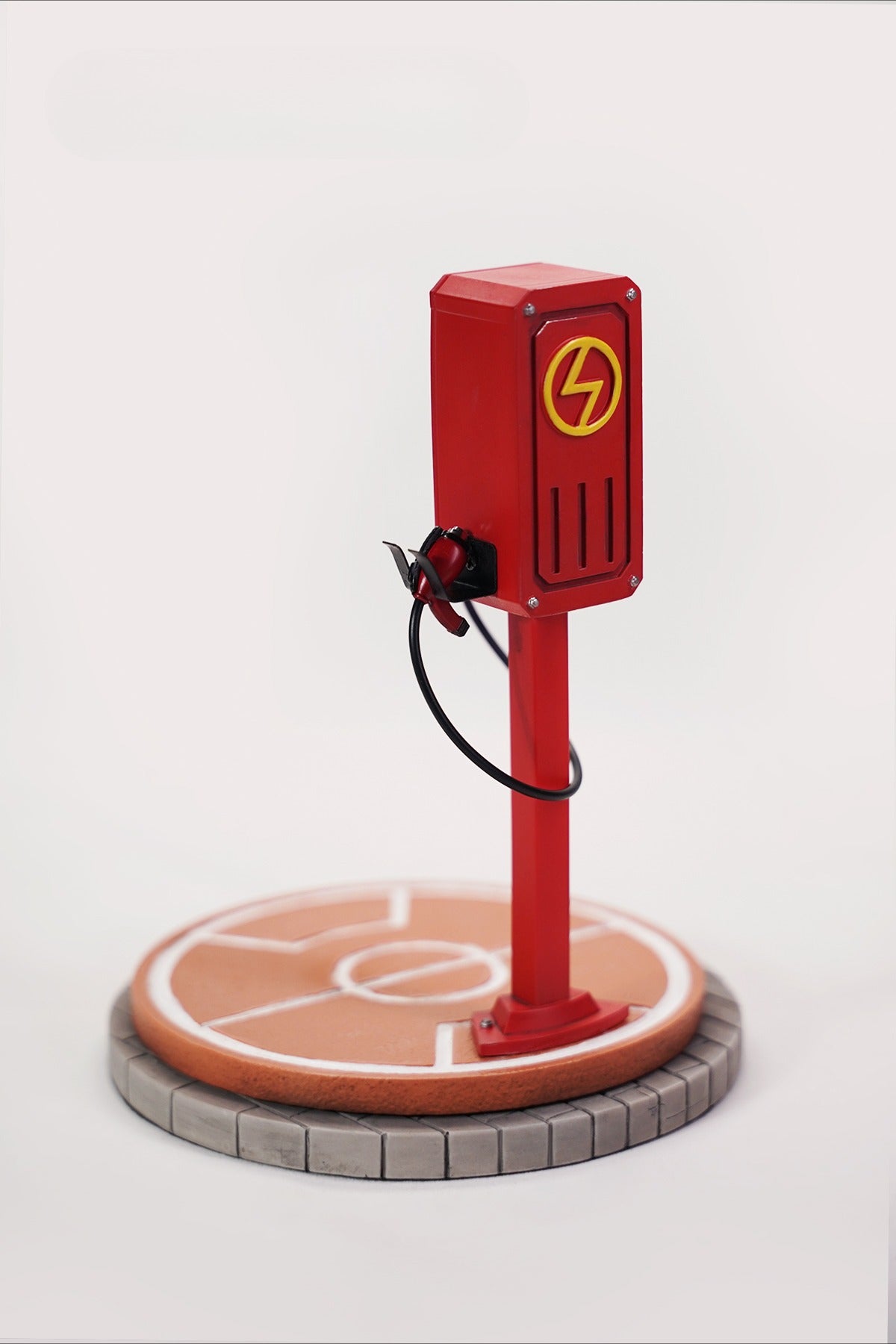 This ElectroCat Charging Station Figurine features a cute cat with a charging pump made from high-quality vinyl. The charging platform adds functionality, allowing the figurine to light up, making it a unique home decor piece and interactive collectible for cat lovers and collectors.