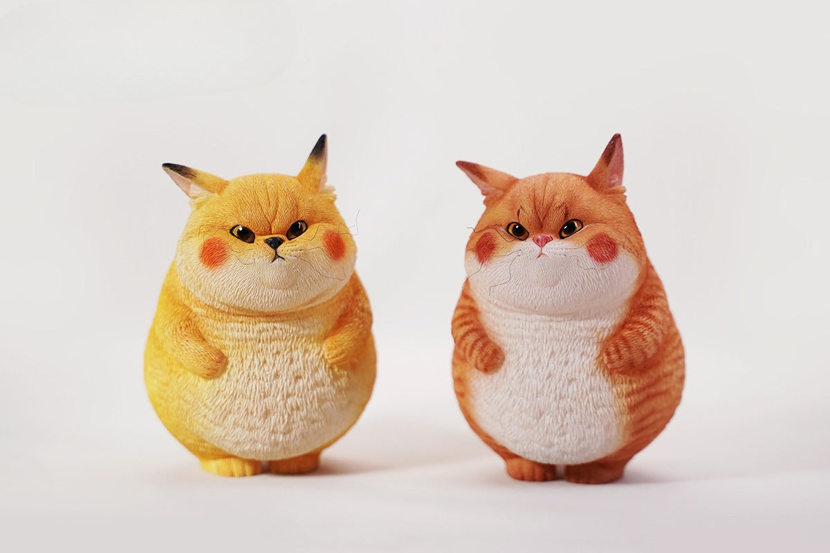 This ElectroCat Charging Station Figurine features a cute cat with a charging pump made from high-quality vinyl. The charging platform adds functionality, allowing the figurine to light up, making it a unique home decor piece and interactive collectible for cat lovers and collectors.