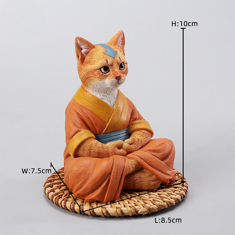 A handcrafted Airbender Cat Figurine in a meditative pose, dressed in an orange robe with a blue sash, sitting on a rattan-weaved cushion. This finely detailed resin sculpture captures the tranquility of mindfulness, perfect for cat lovers and meditation enthusiasts. An ideal collectible and decorative accent for any serene space.
