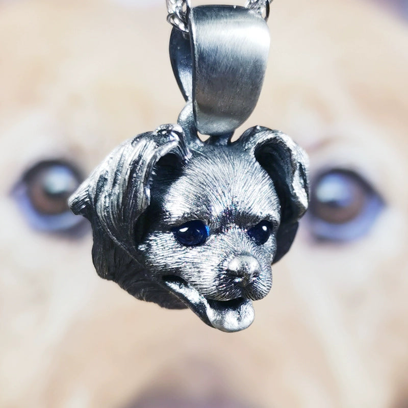 Close-up image of a handcrafted Farm Dog Pendant made from 925 silver, showcasing detailed fur texture and gemstone eyes. The pendant captures the essence of a beloved pet, offering a beautiful tribute to farm dog lovers. Available in silver and antique black finishes.