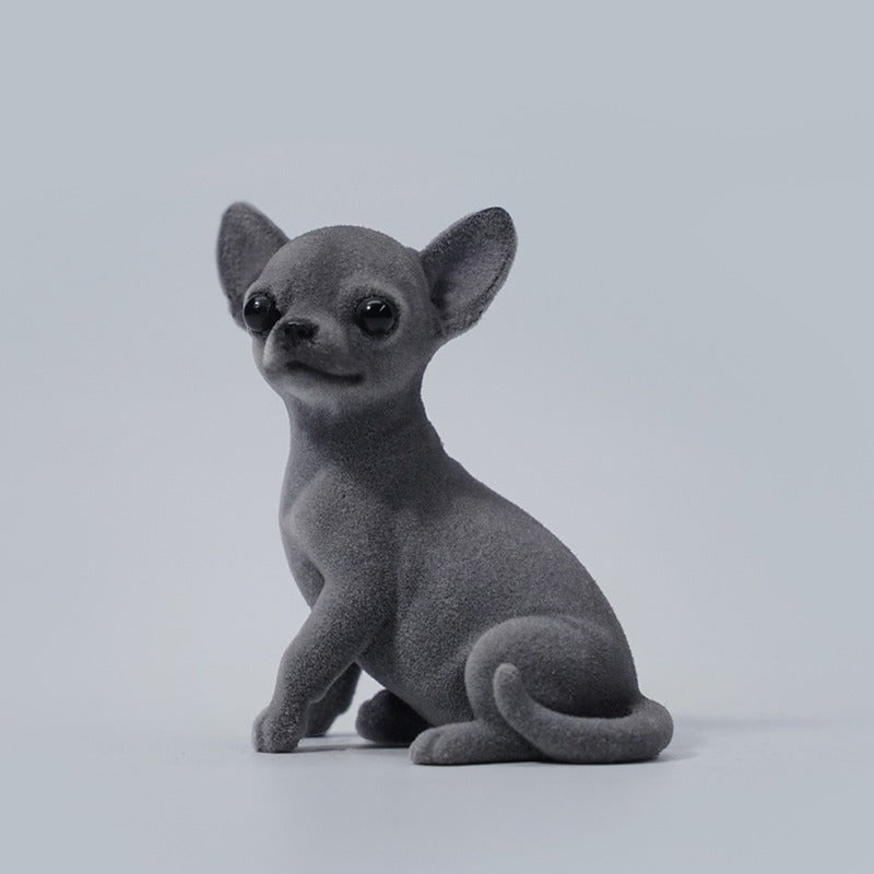 1/6 scale Chihuahua simulation animal models featuring realistic and detailed representations of the Chihuahua breed. These figurines showcase the distinct features of Chihuahuas, including their expressive eyes and alert ears. Available in various colors, these models are perfect for collectors and dog enthusiasts, adding a charming touch to any decor.