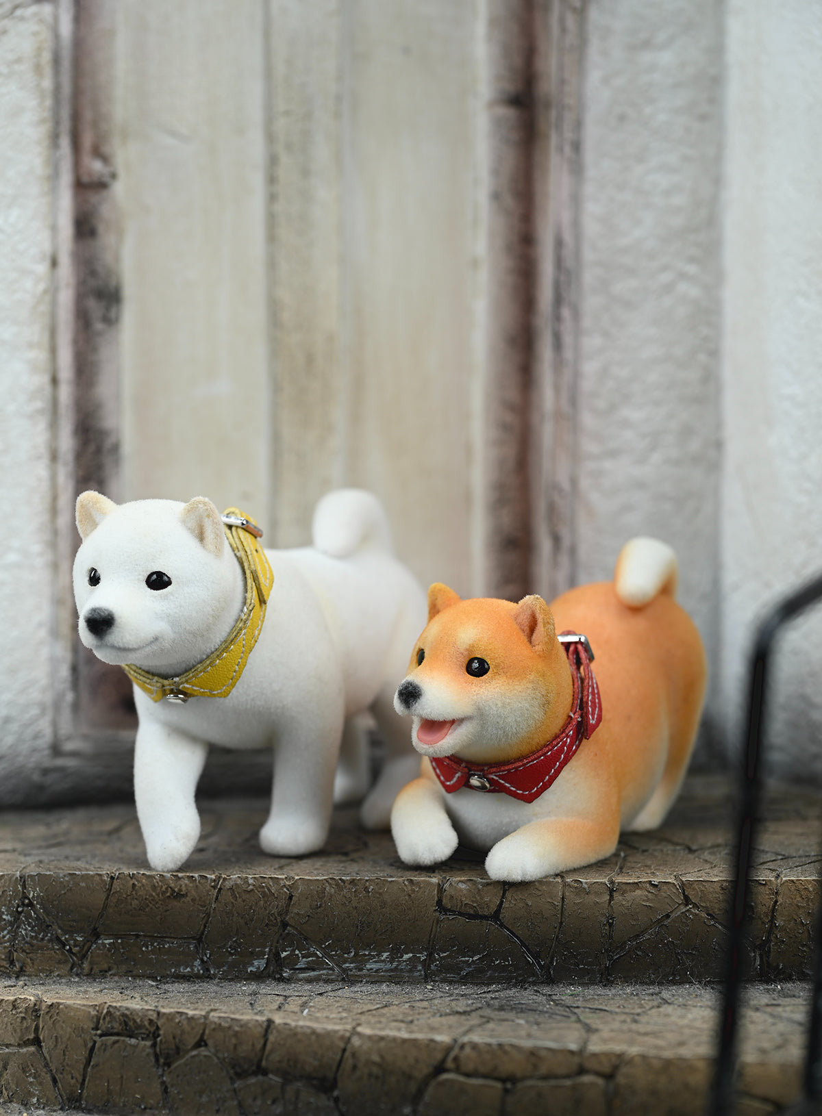 A set of three flocking Shiba Inu dog models in different colors - black, white, and tan. Each model features a realistic and adorable design with a collar in different colors: blue, yellow, and red. The dogs are shown in various poses, including waving, standing, and sitting.