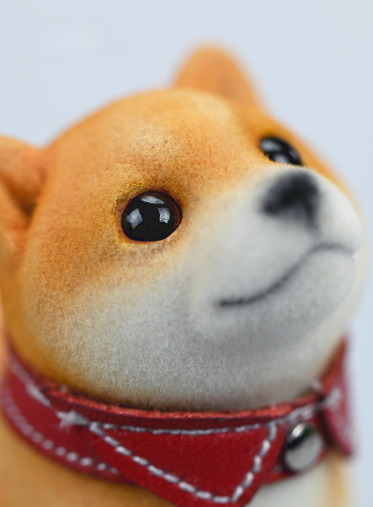 A set of three flocking Shiba Inu dog models in different colors - black, white, and tan. Each model features a realistic and adorable design with a collar in different colors: blue, yellow, and red. The dogs are shown in various poses, including waving, standing, and sitting.