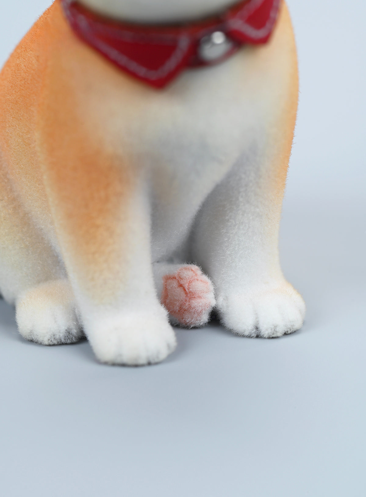 A set of three flocking Shiba Inu dog models in different colors - black, white, and tan. Each model features a realistic and adorable design with a collar in different colors: blue, yellow, and red. The dogs are shown in various poses, including waving, standing, and sitting.