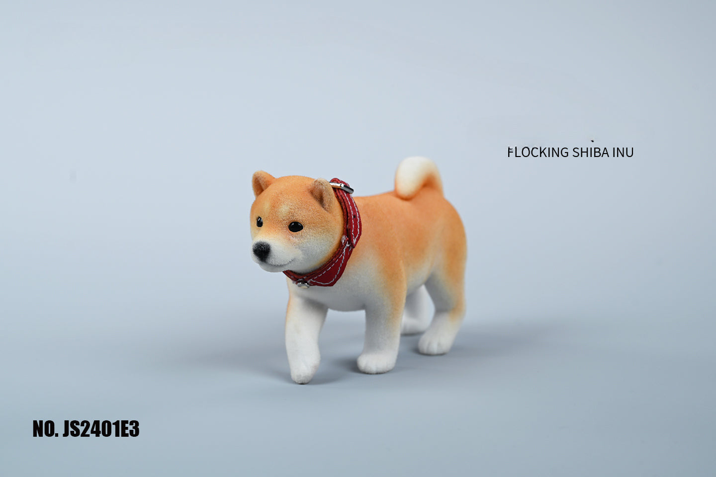 A set of three flocking Shiba Inu dog models in different colors - black, white, and tan. Each model features a realistic and adorable design with a collar in different colors: blue, yellow, and red. The dogs are shown in various poses, including waving, standing, and sitting.