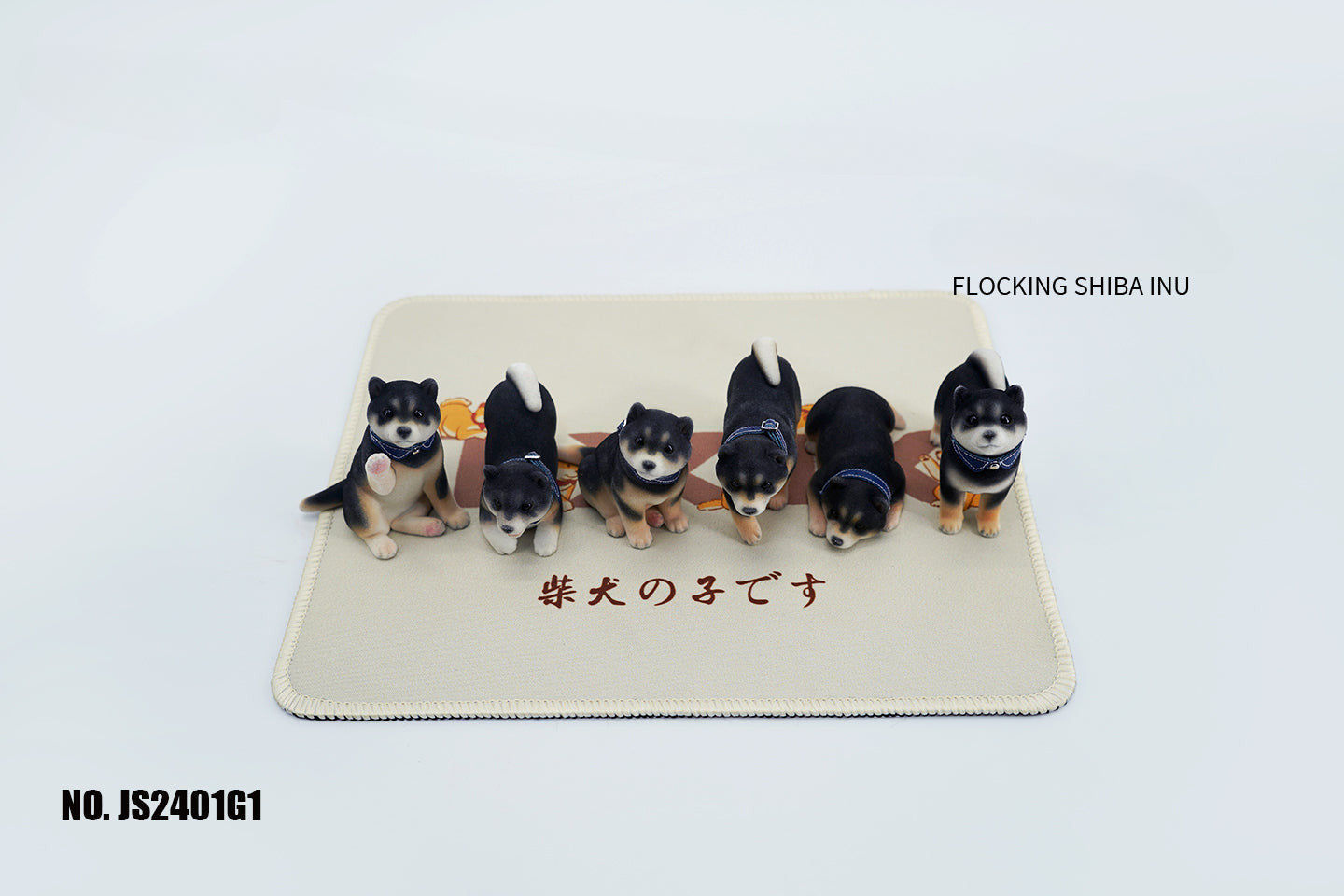 A set of three flocking Shiba Inu dog models in different colors - black, white, and tan. Each model features a realistic and adorable design with a collar in different colors: blue, yellow, and red. The dogs are shown in various poses, including waving, standing, and sitting.